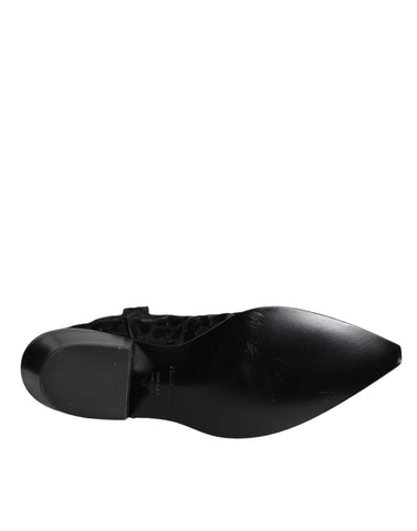Dolce & Gabbana black and gray leopard cowboy boots with pointed toes and Western style stitching.
