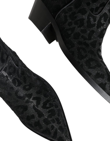 Black and gray leopard print cowboy boots by Dolce & Gabbana, featuring pointed toes and classic Western-style design.