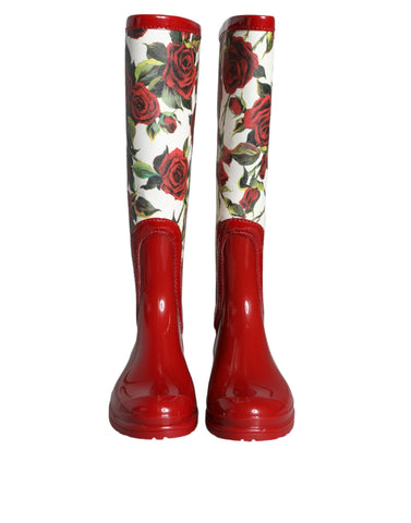 Red floral rubber knee-high flat boots by Dolce & Gabbana, featuring vibrant floral patterns and waterproof material.