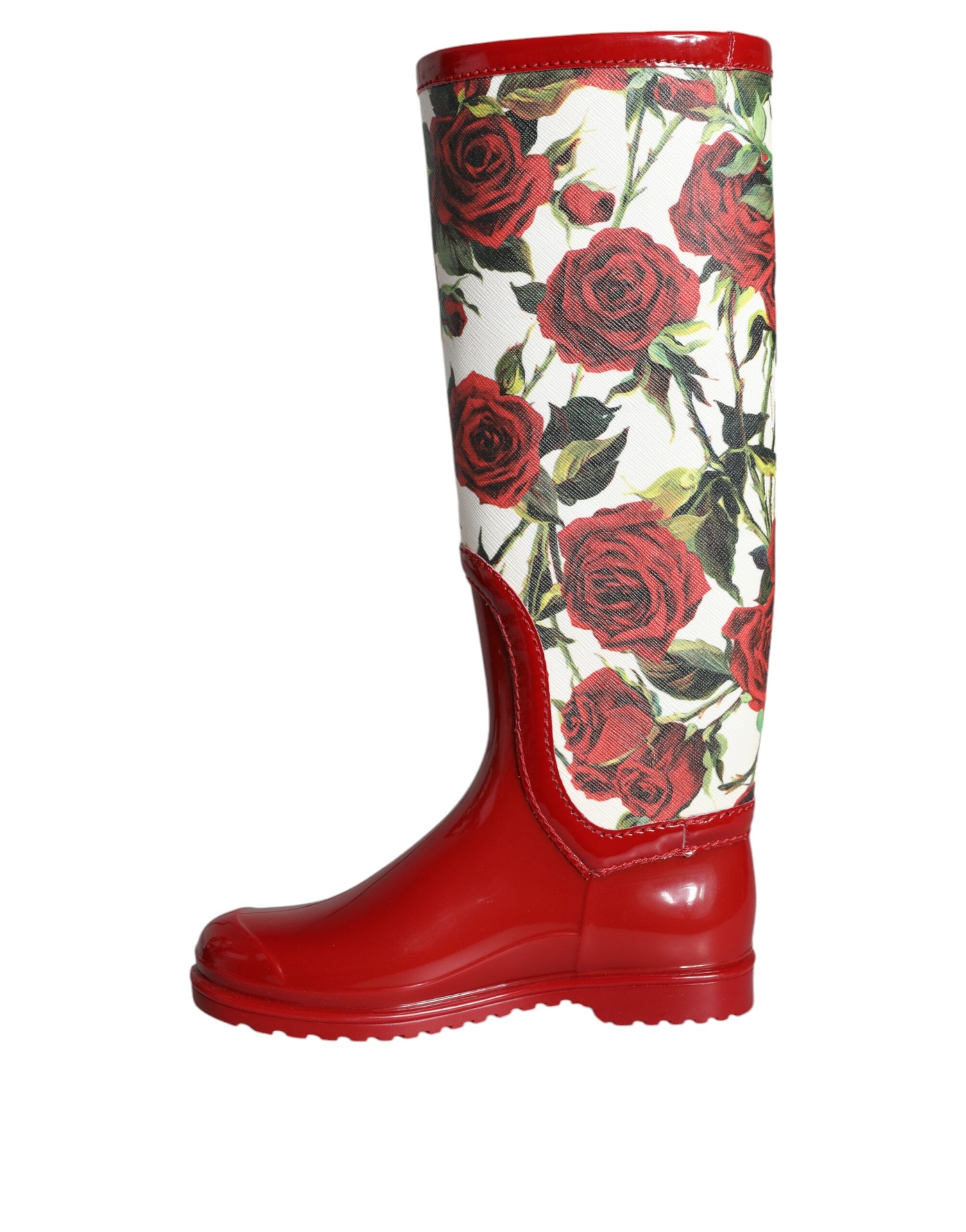 Red floral rubber knee-high flat boots from Dolce & Gabbana with vibrant floral patterns and smooth rubber finish.