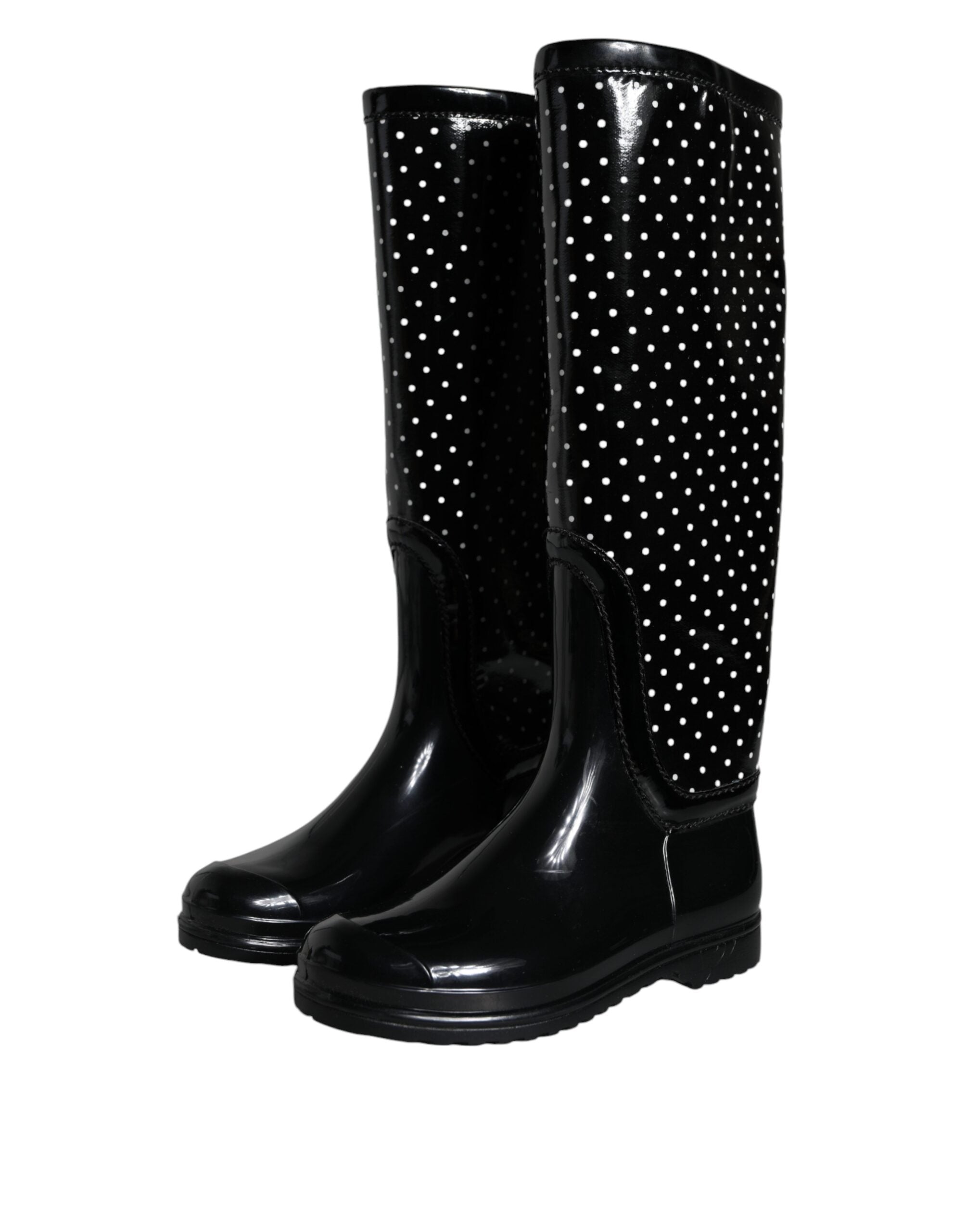 Black polka dot rubber knee-high boots by Dolce & Gabbana with a glossy finish and stylish design.