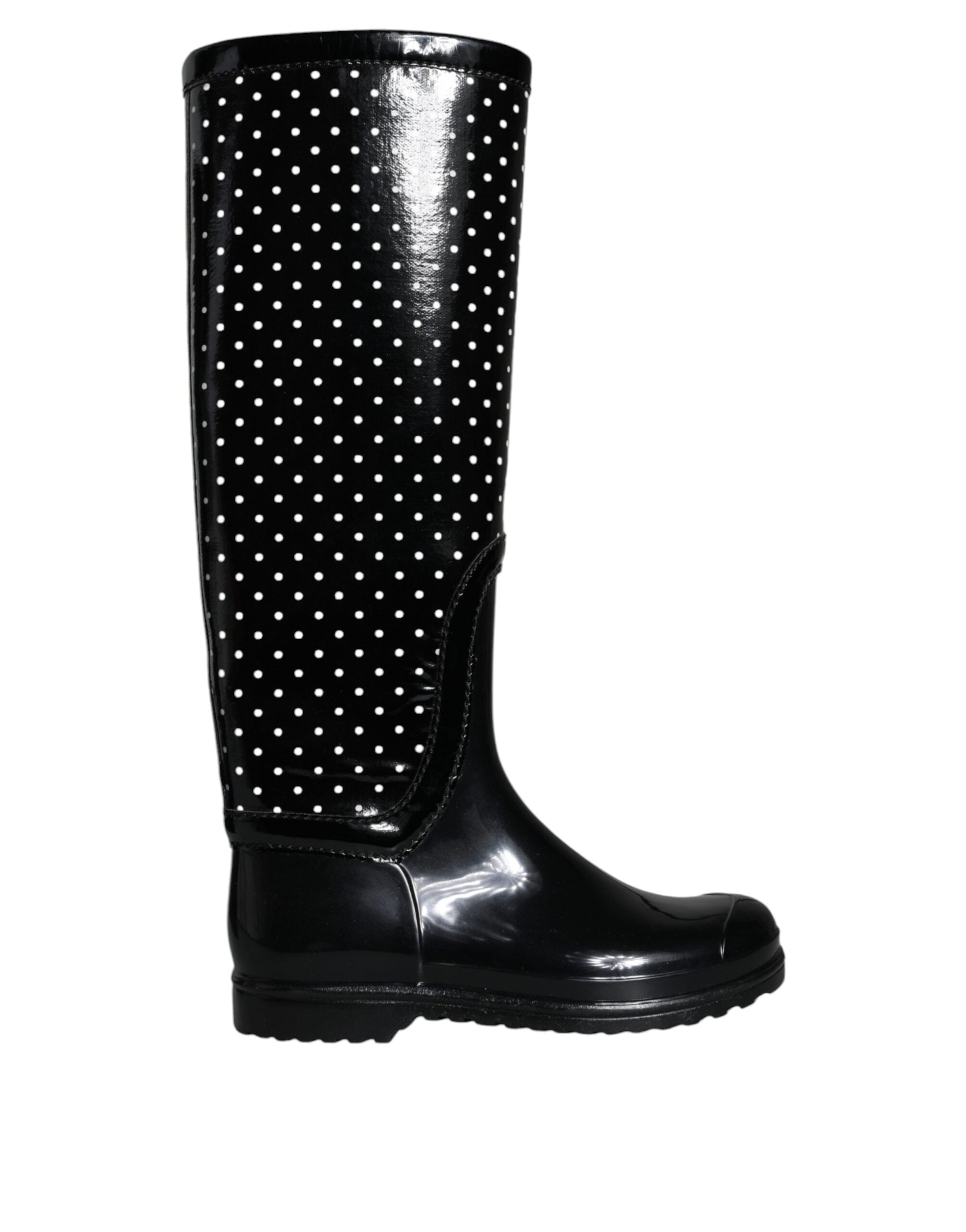 Black polka dot rubber knee-high boots by Dolce & Gabbana with a glossy finish and rounded toe, stylish and waterproof footwear.