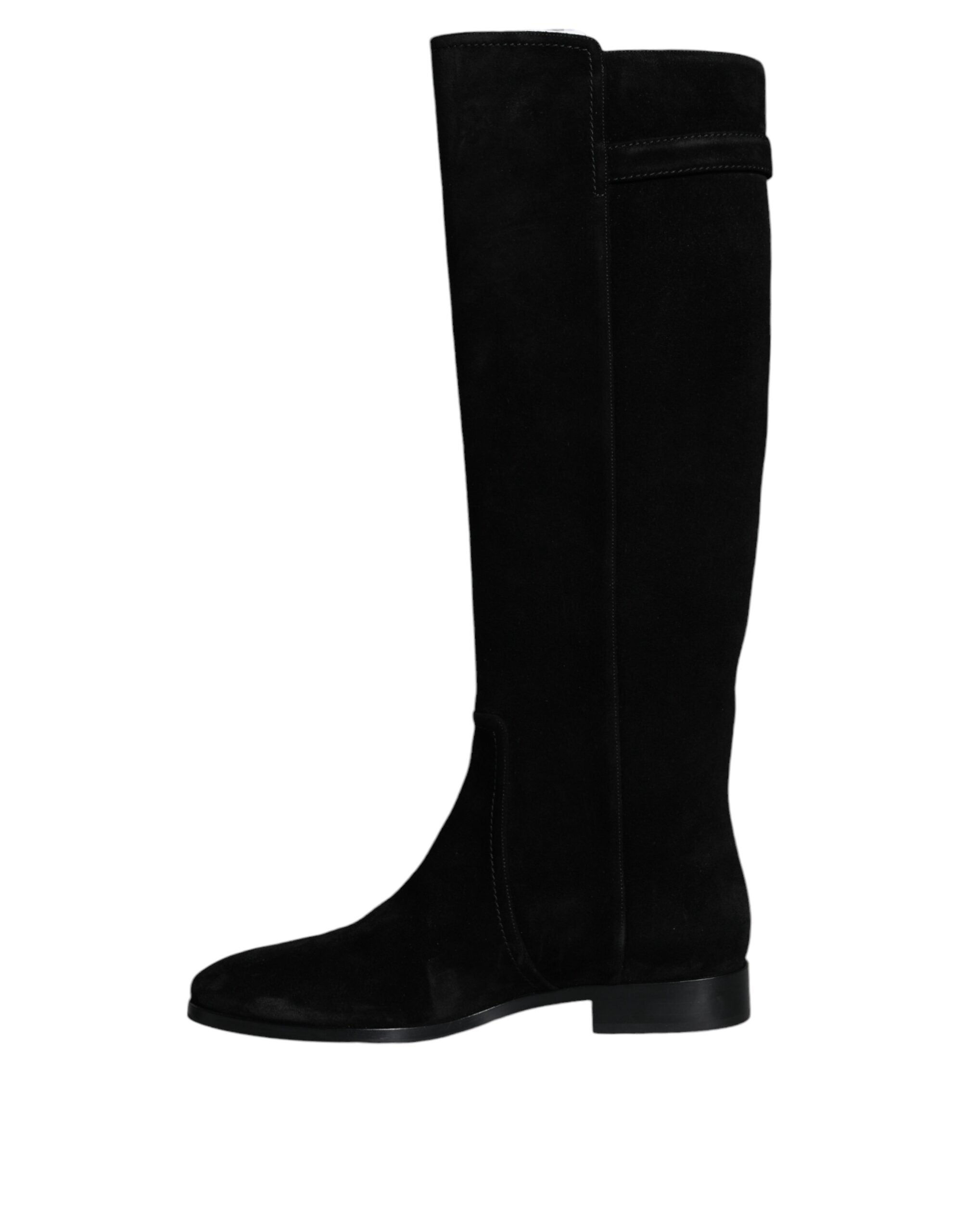 Black suede leather knee-high boots by Dolce & Gabbana with pointed toes and high heels, styled for a chic, sophisticated look.