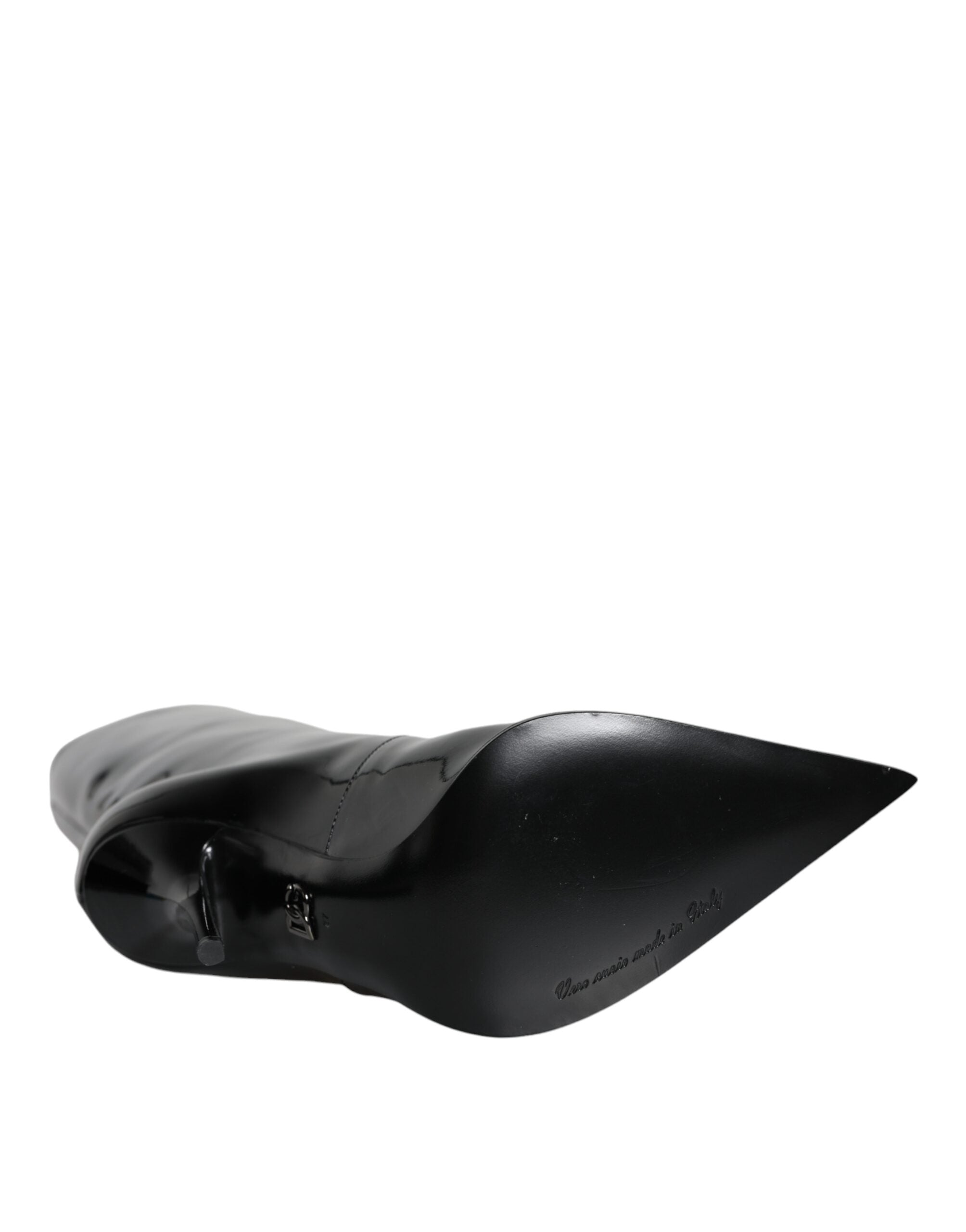 Black patent leather mid-calf boots by Dolce & Gabbana, stylish knee-high shoes with a sleek shiny finish.