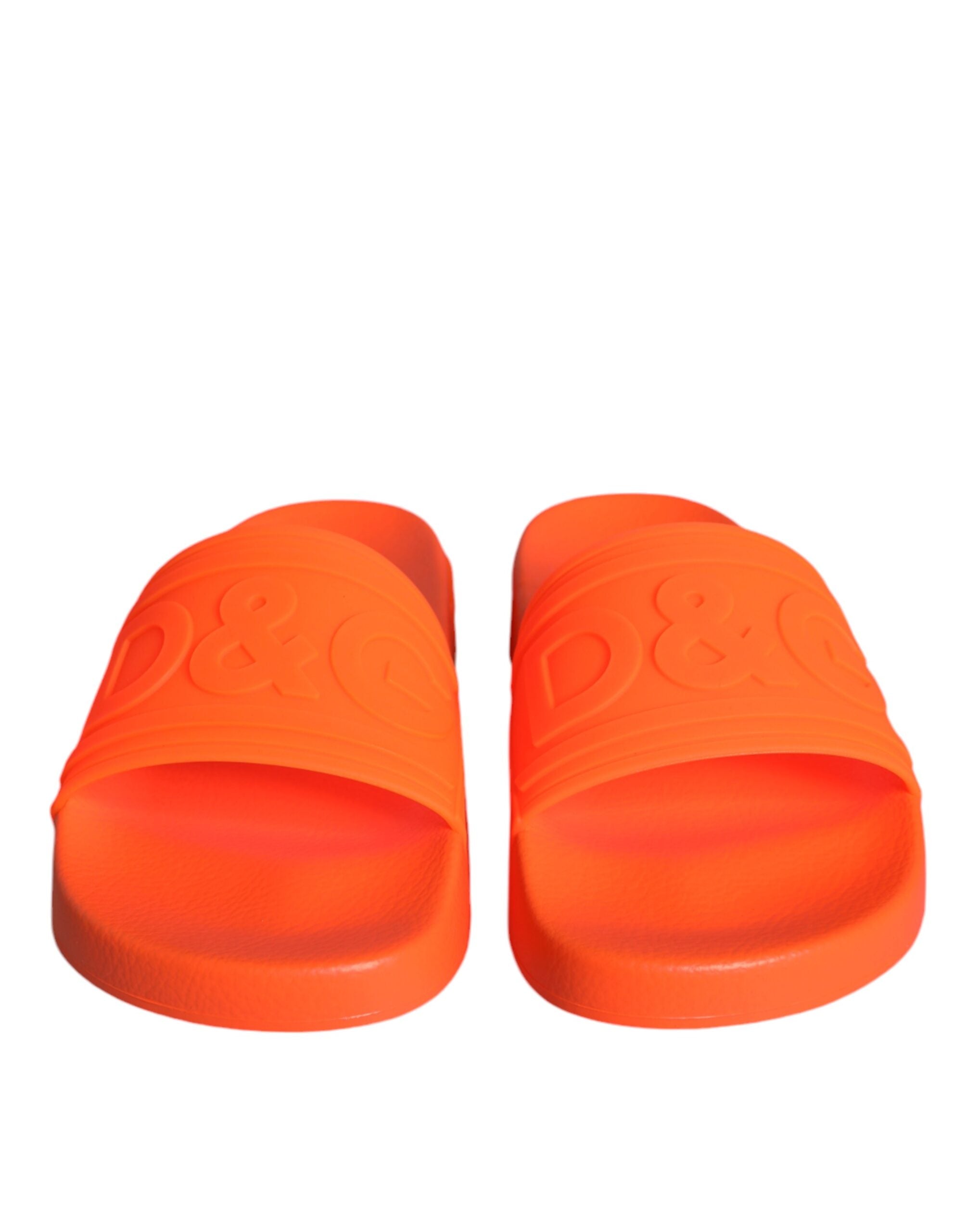 Orange rubber slides sandals by Dolce & Gabbana, beachwear shoes with open-toe design and casual slip-on style.