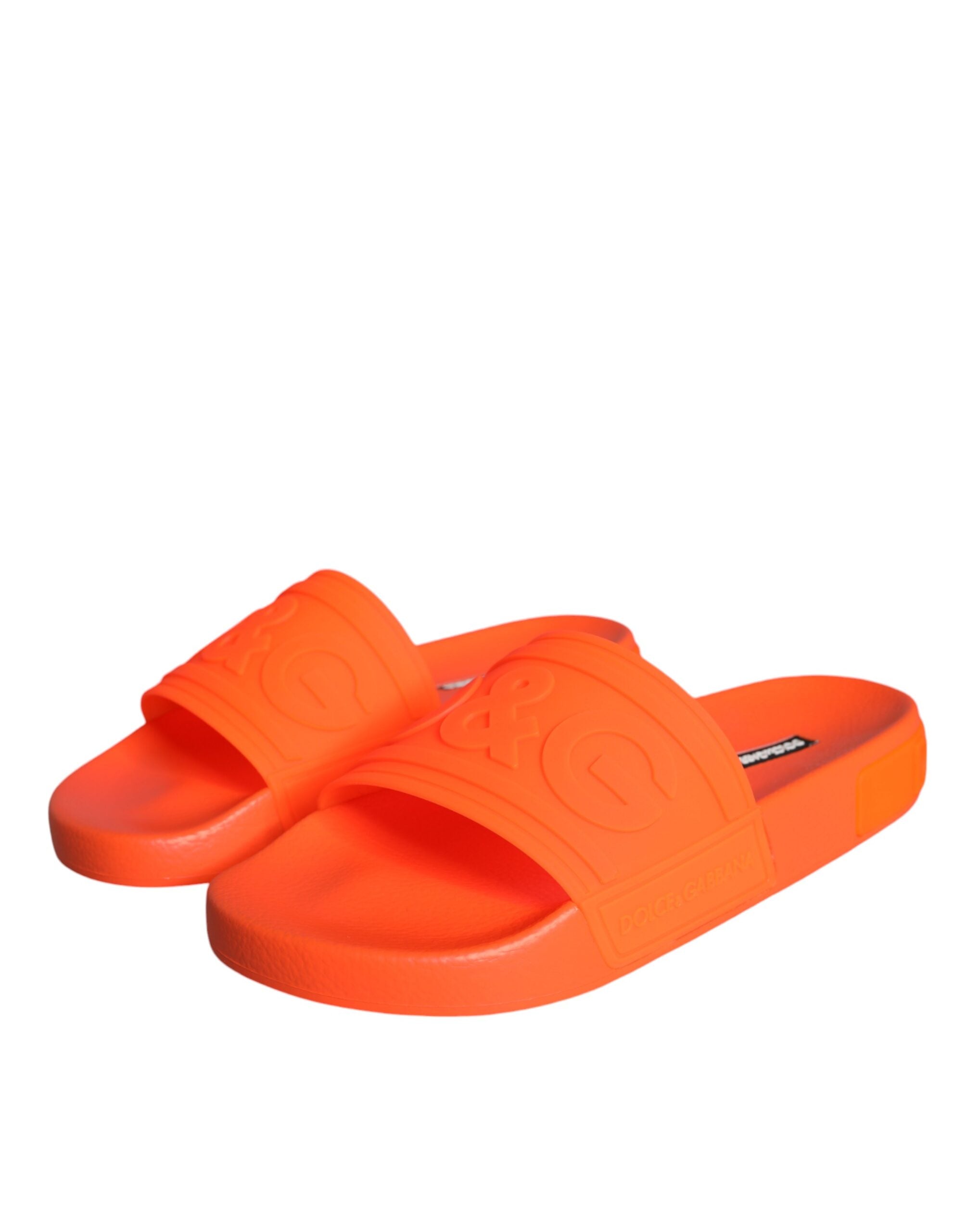 Orange rubber slides sandals by Dolce & Gabbana, beachwear shoes with slip-on design and textured sole.