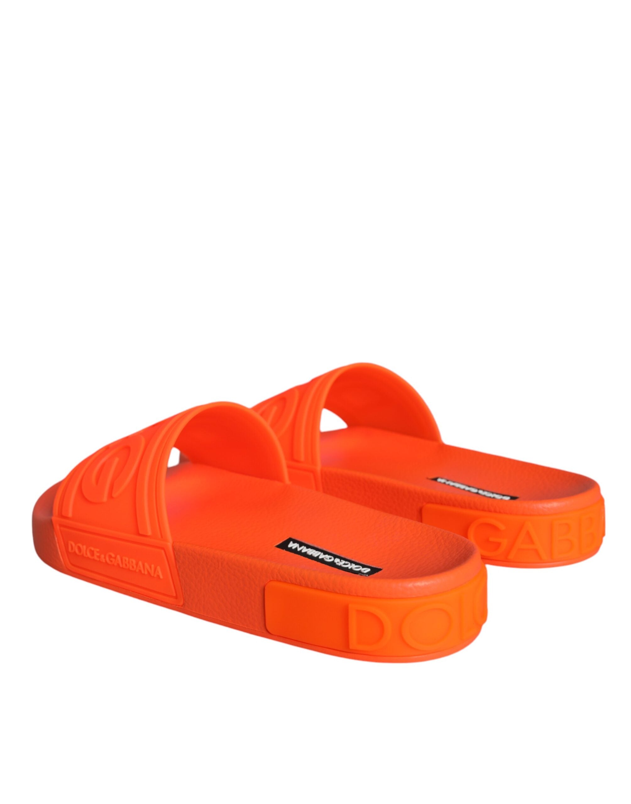 Orange rubber slides sandals by Dolce & Gabbana, featuring a casual beachwear style with open-toe design and slip-on fit.