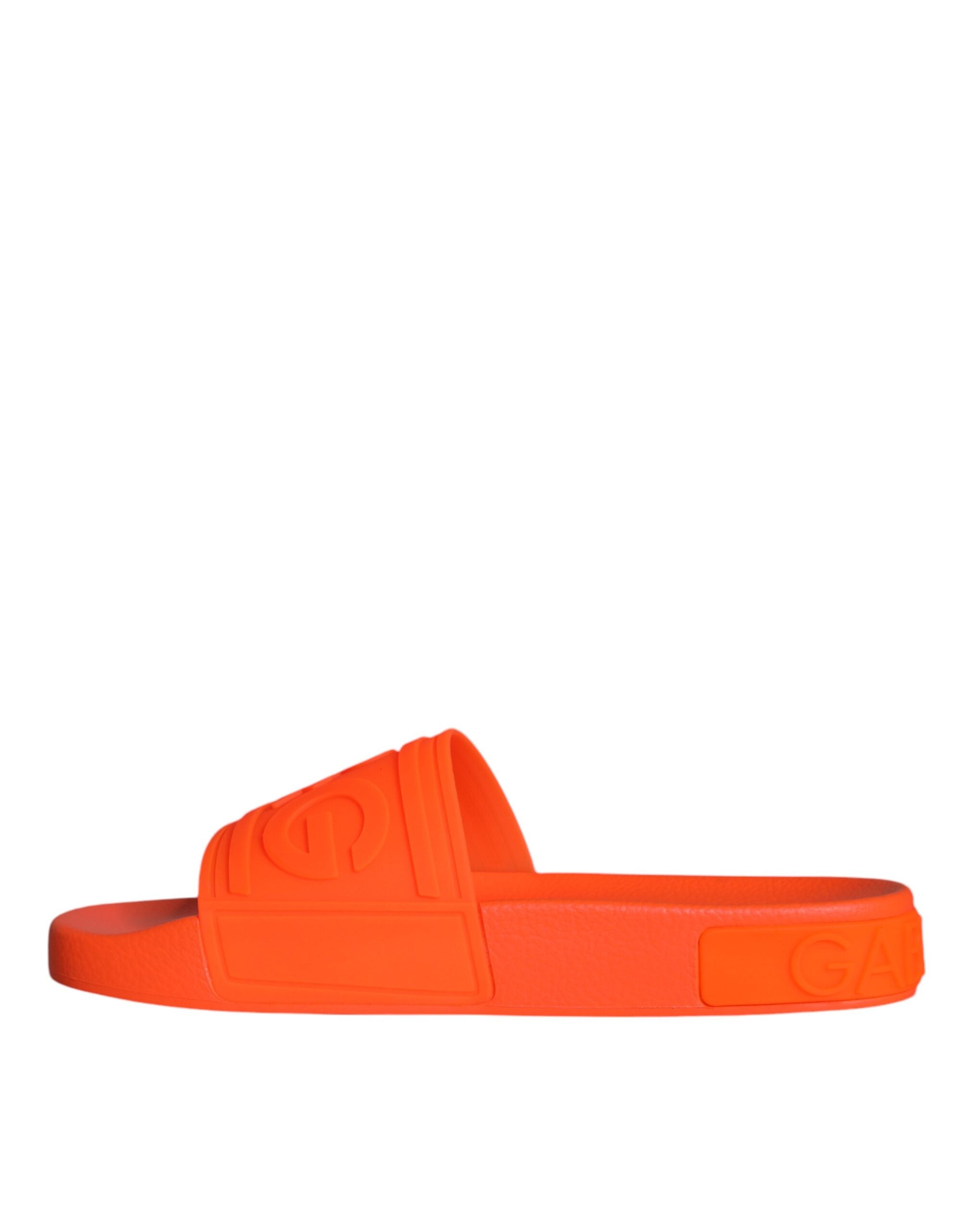 Orange rubber slides sandals by Dolce & Gabbana, beachwear shoes with open toe design and casual slip-on style.