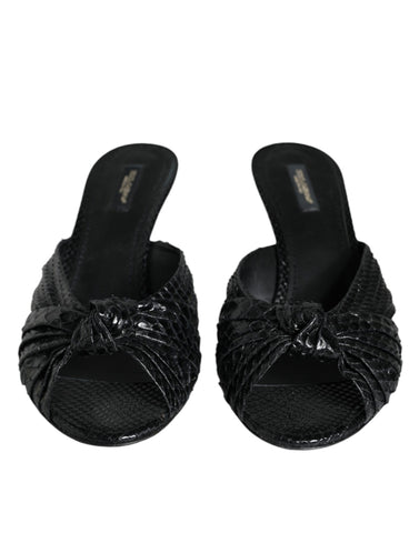Black leather Dolce & Gabbana slide sandals with open toes and slip-on design, perfect for stylish summer footwear.