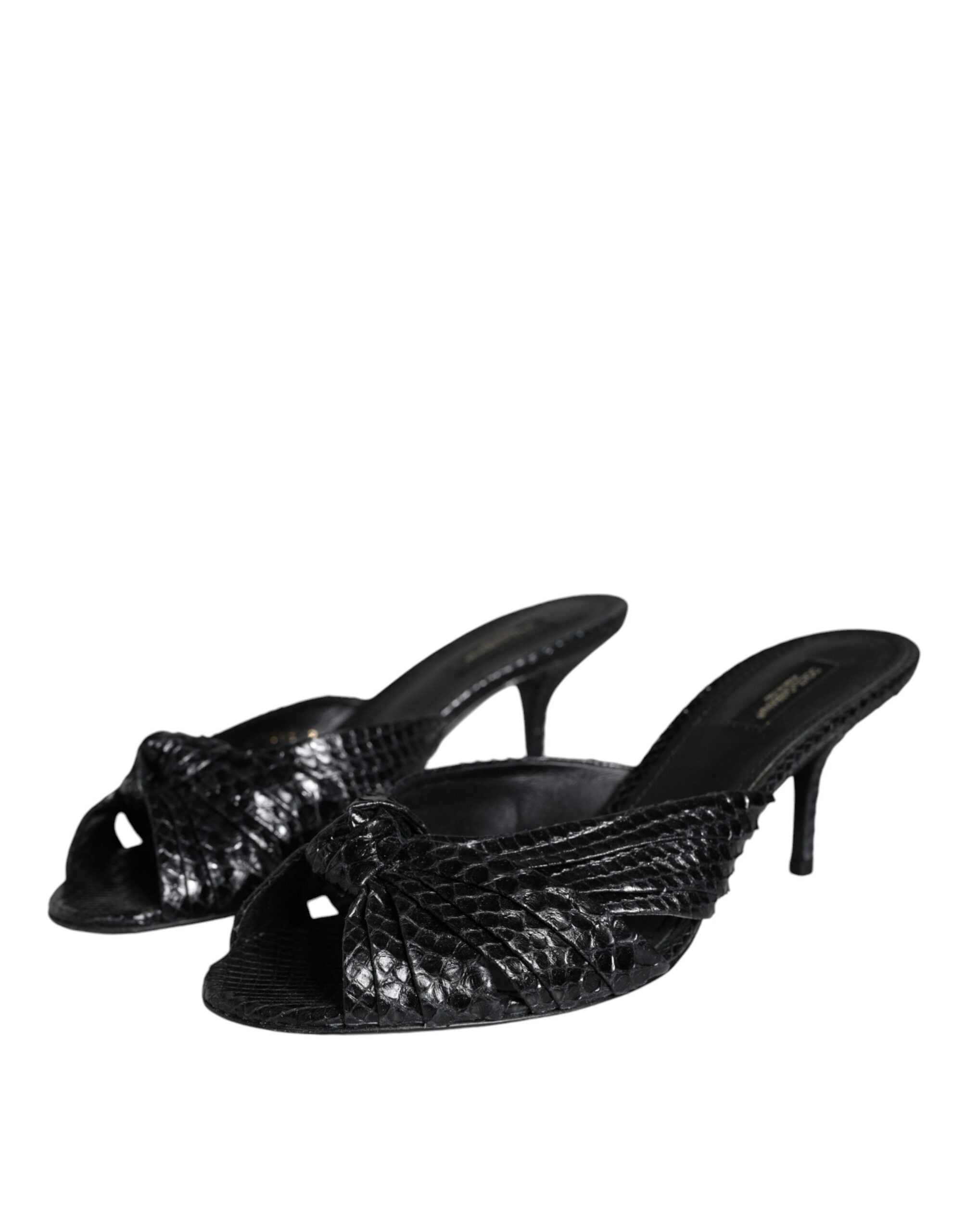 Black leather slide sandals with open toes and flat soles by Dolce & Gabbana, stylish footwear for casual or dressy occasions.