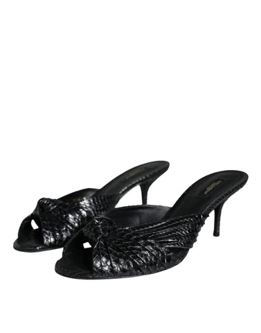Black leather slide sandals with open toes and flat soles by Dolce & Gabbana, stylish footwear for casual or dressy occasions.