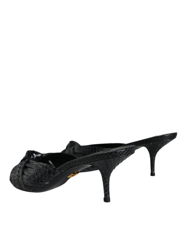 Black leather slide sandals by Dolce & Gabbana with open toe and chunky heel, showcasing sleek design and smooth leather finish.