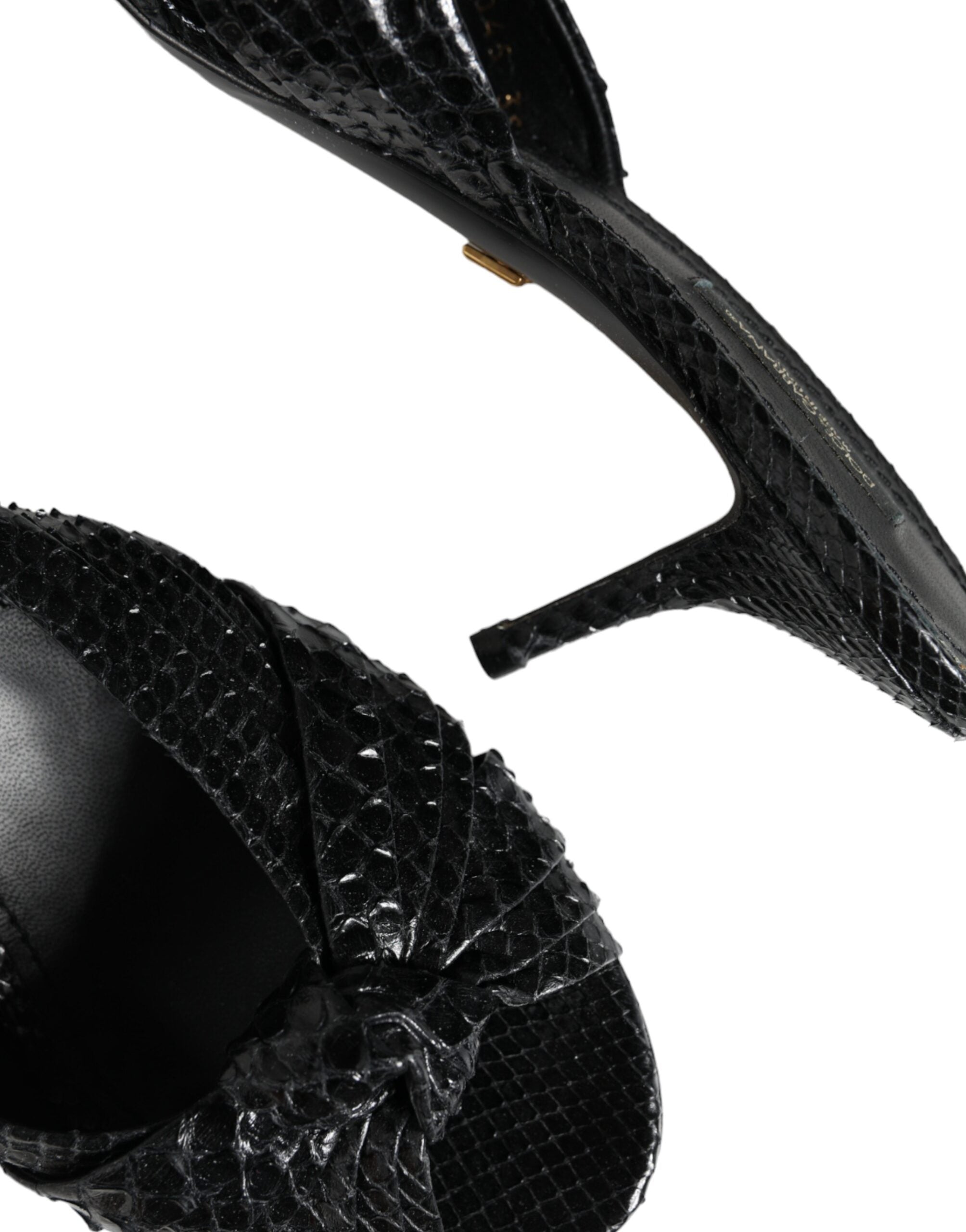 Black leather slide sandals with open-toe design from Dolce & Gabbana, featuring sleek, minimalist style and comfortable flat sole.