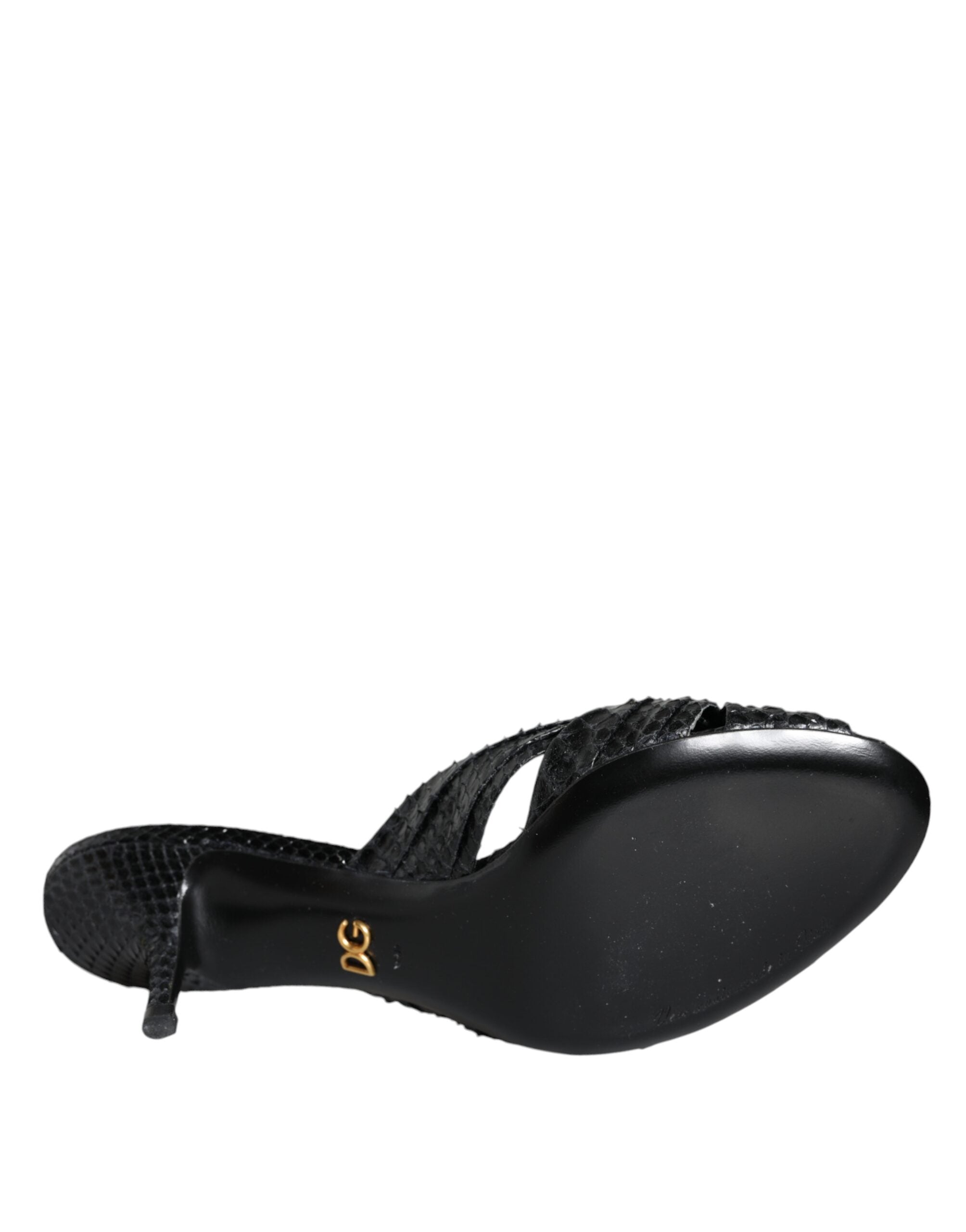 Black leather Dolce & Gabbana slide sandals with open toes and flat heels, featuring a sleek, minimalist design.
