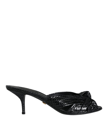 Black leather slide sandals with open toes and block heels from Dolce & Gabbana, stylish and comfortable for casual wear.