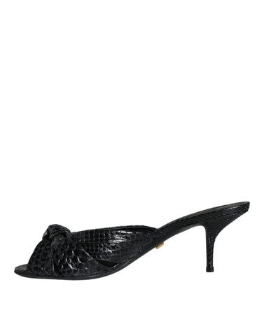 Black leather Dolce & Gabbana slides sandals with open toes and slip-on design, featuring sleek, stylish footwear for women.