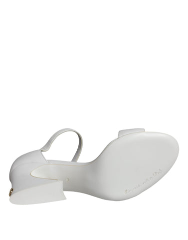 White leather Keira sandals by Dolce & Gabbana with open-toe design and elegant heel, perfect for stylish summer footwear.