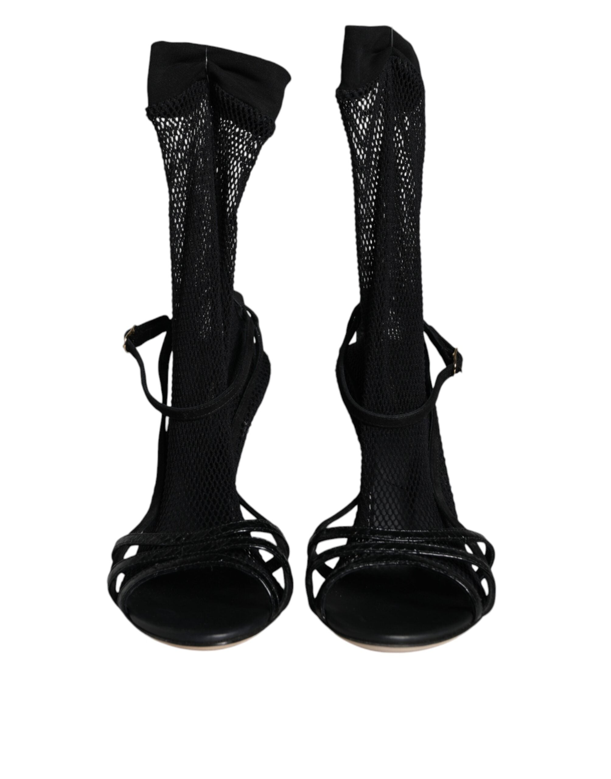 Black mesh stiletto heels sandals by Dolce & Gabbana featuring open toes and high slender heels.