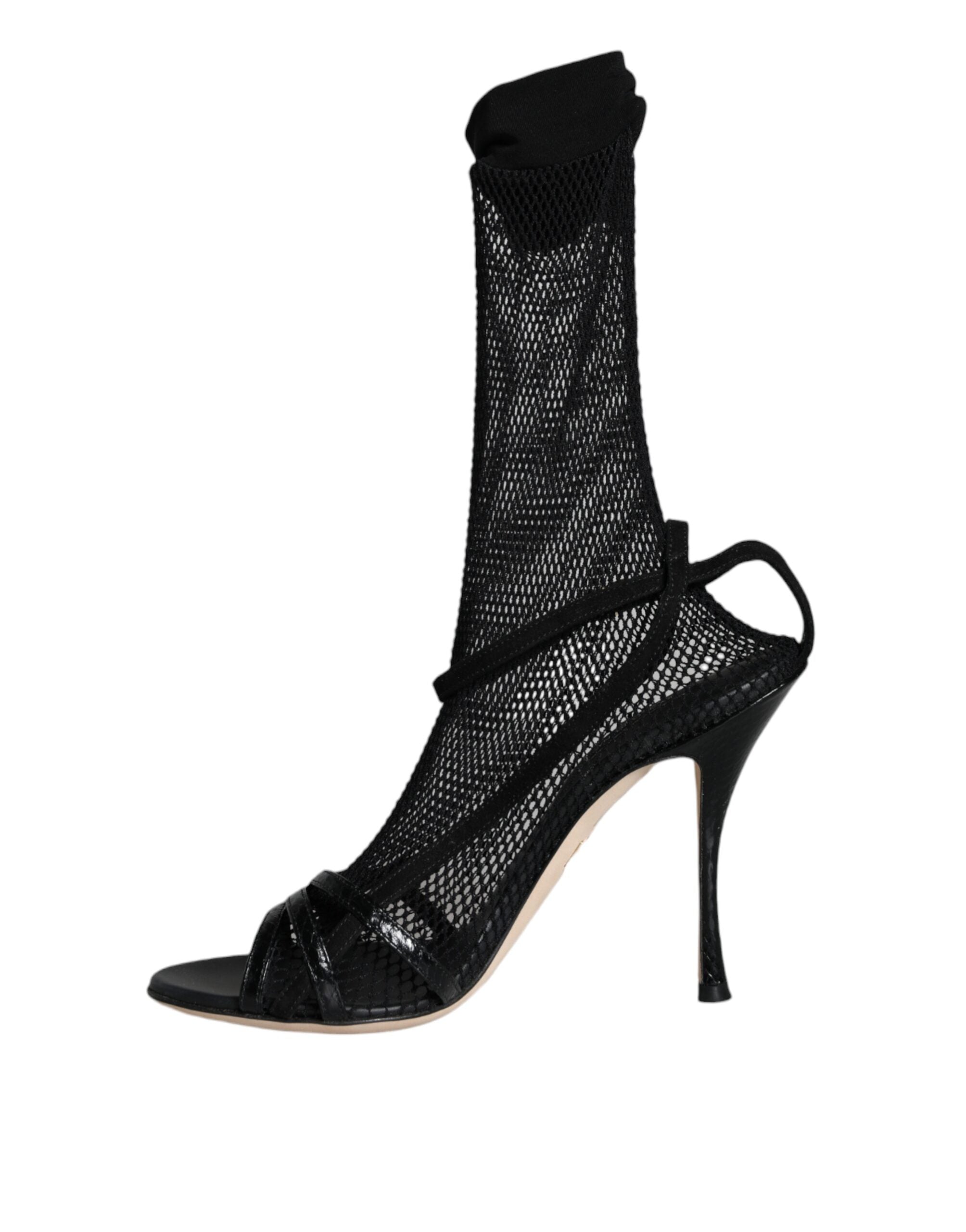 Black mesh stiletto heel sandals by Dolce & Gabbana, showcasing elegant open-toe design and slender high heels.