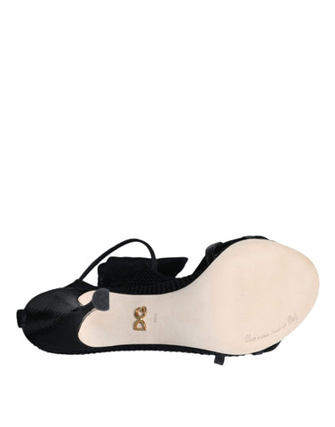 Black mesh stiletto heel sandals by Dolce & Gabbana featuring open toes and ankle straps.