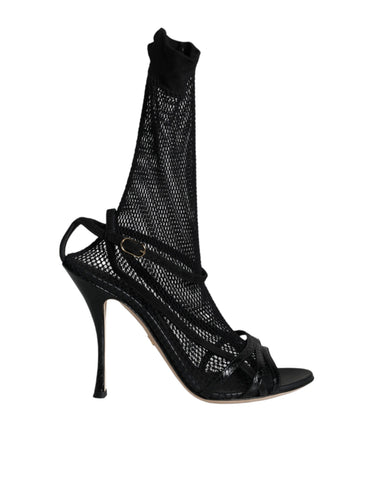 Black mesh stiletto heel sandals by Dolce & Gabbana, featuring open toes and sleek design, shown on a white background.