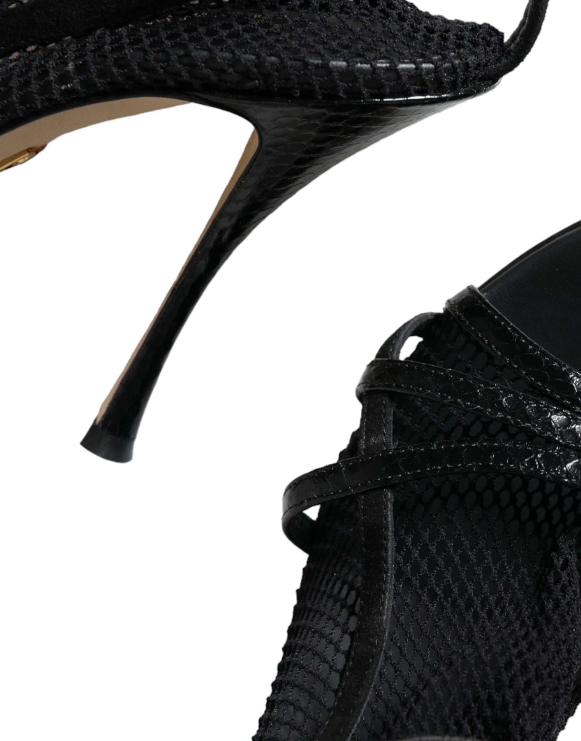 Black mesh stiletto heels sandals by Dolce & Gabbana featuring open toes and sleek high-heeled design.