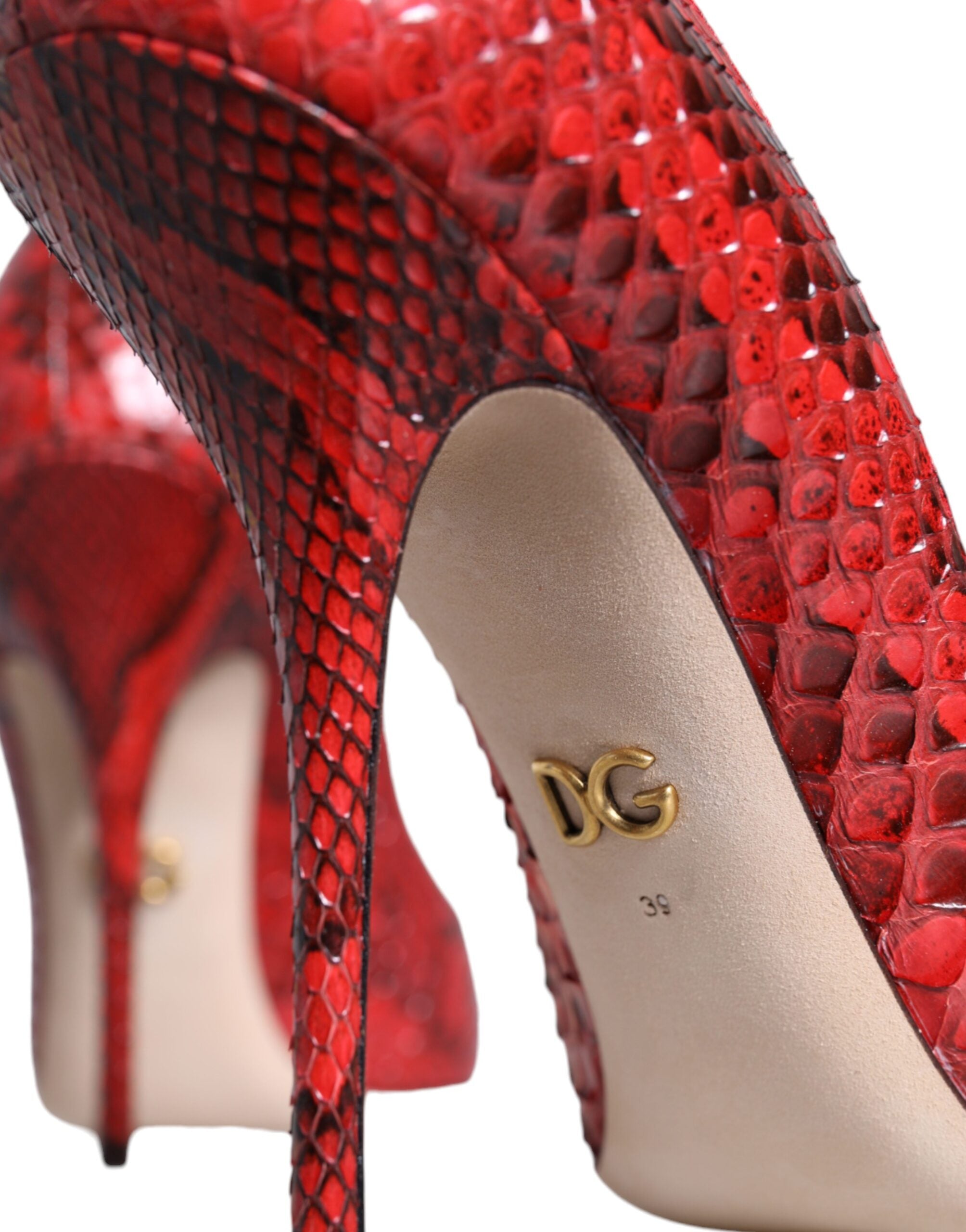 Red leather stiletto high heel pumps by Dolce & Gabbana, featuring sleek pointed toes and elegant slim heels.