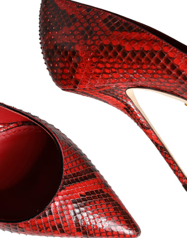 Red leather stiletto high heels pumps by Dolce & Gabbana, featuring pointed toes and sleek design.