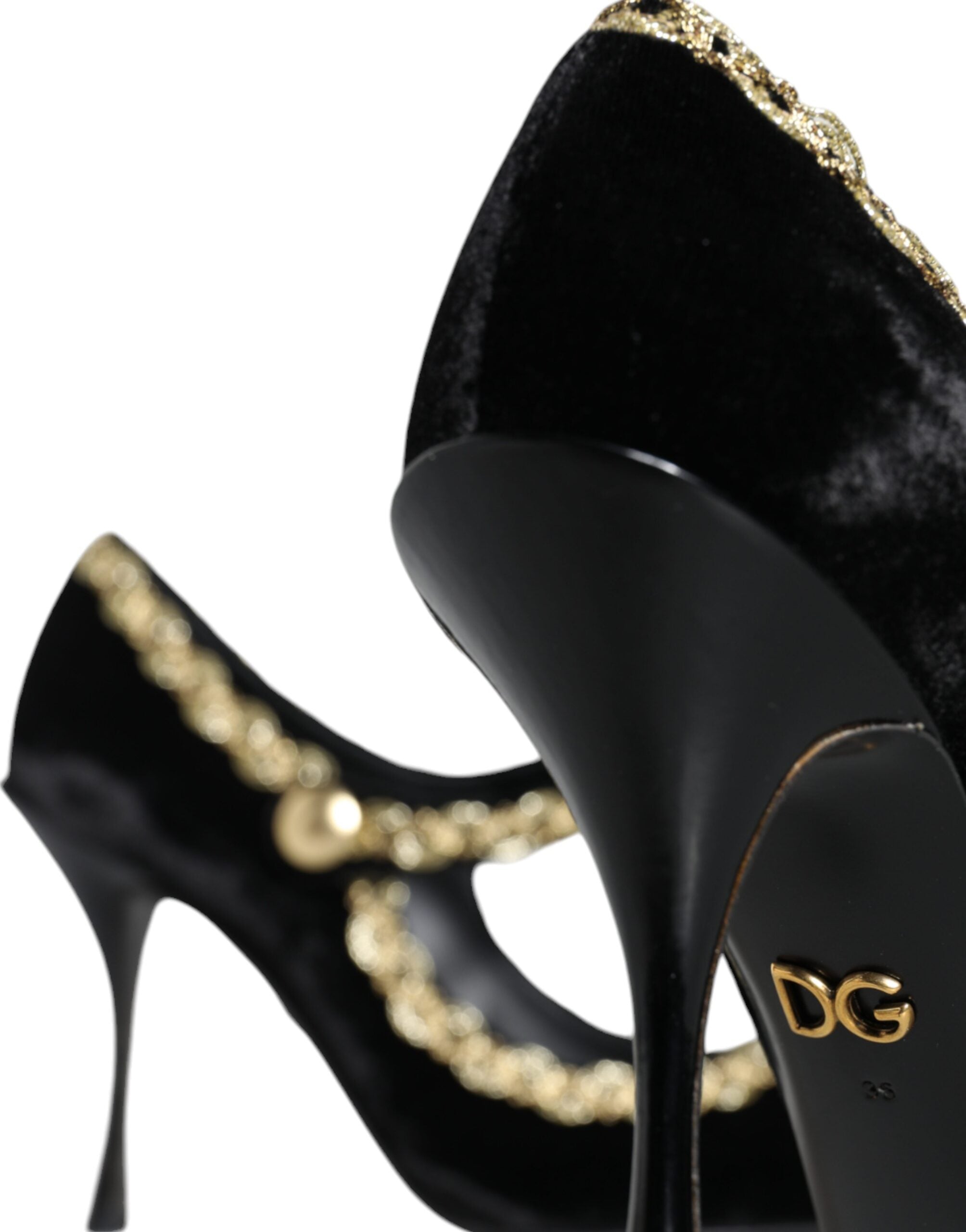 Black velvet Mary Jane pumps with gold accents, stylish Dolce & Gabbana footwear, featuring a classic strap and elegant design.