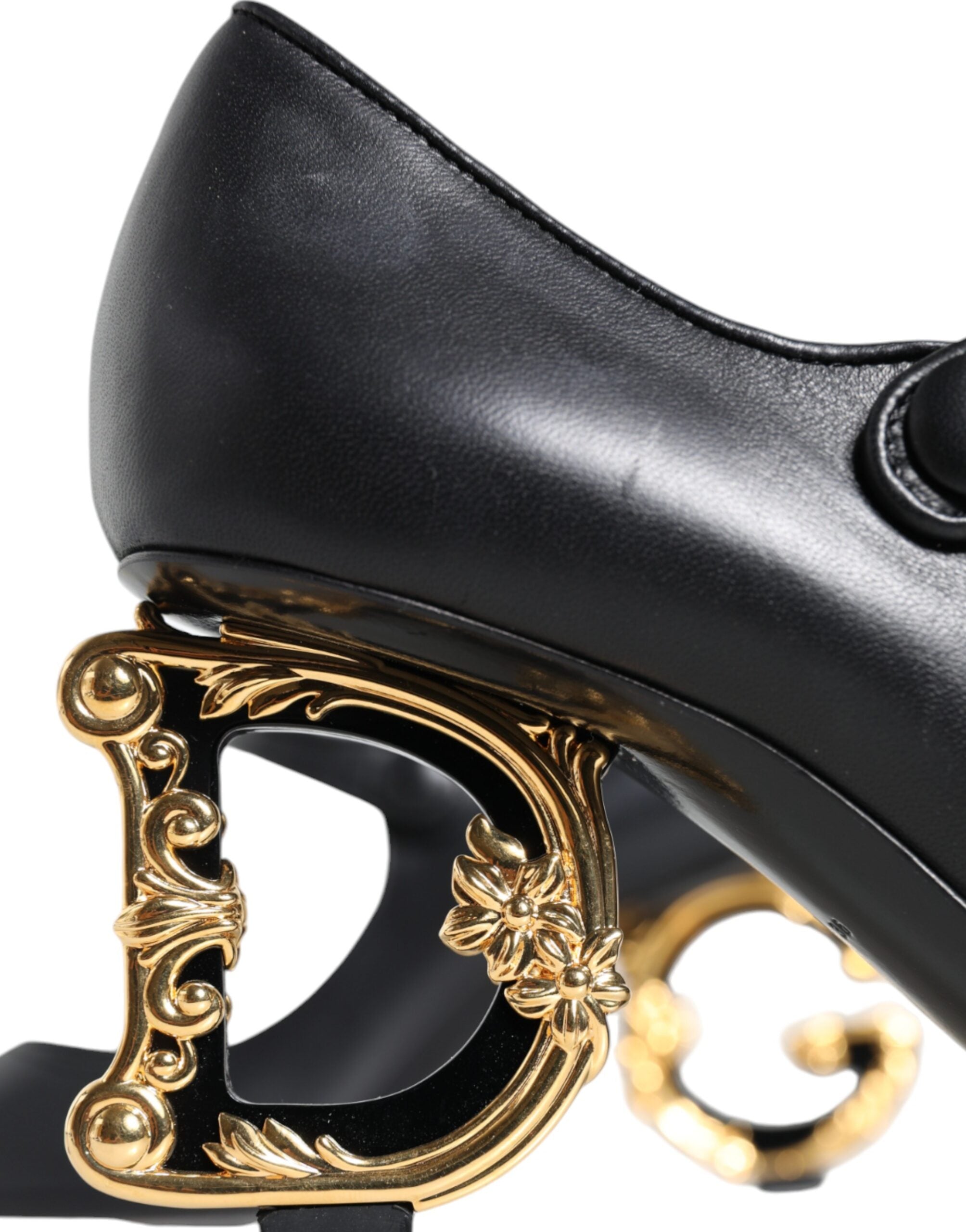 Black leather Mary Janes pumps with Dolce & Gabbana logo, stylish heeled shoes featuring a classic design and smooth finish.