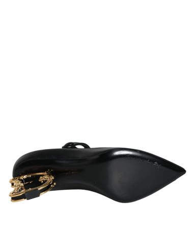 Black leather Dolce & Gabbana logo heels featuring Mary Jane pumps with a stylish strap and pointed toe design.