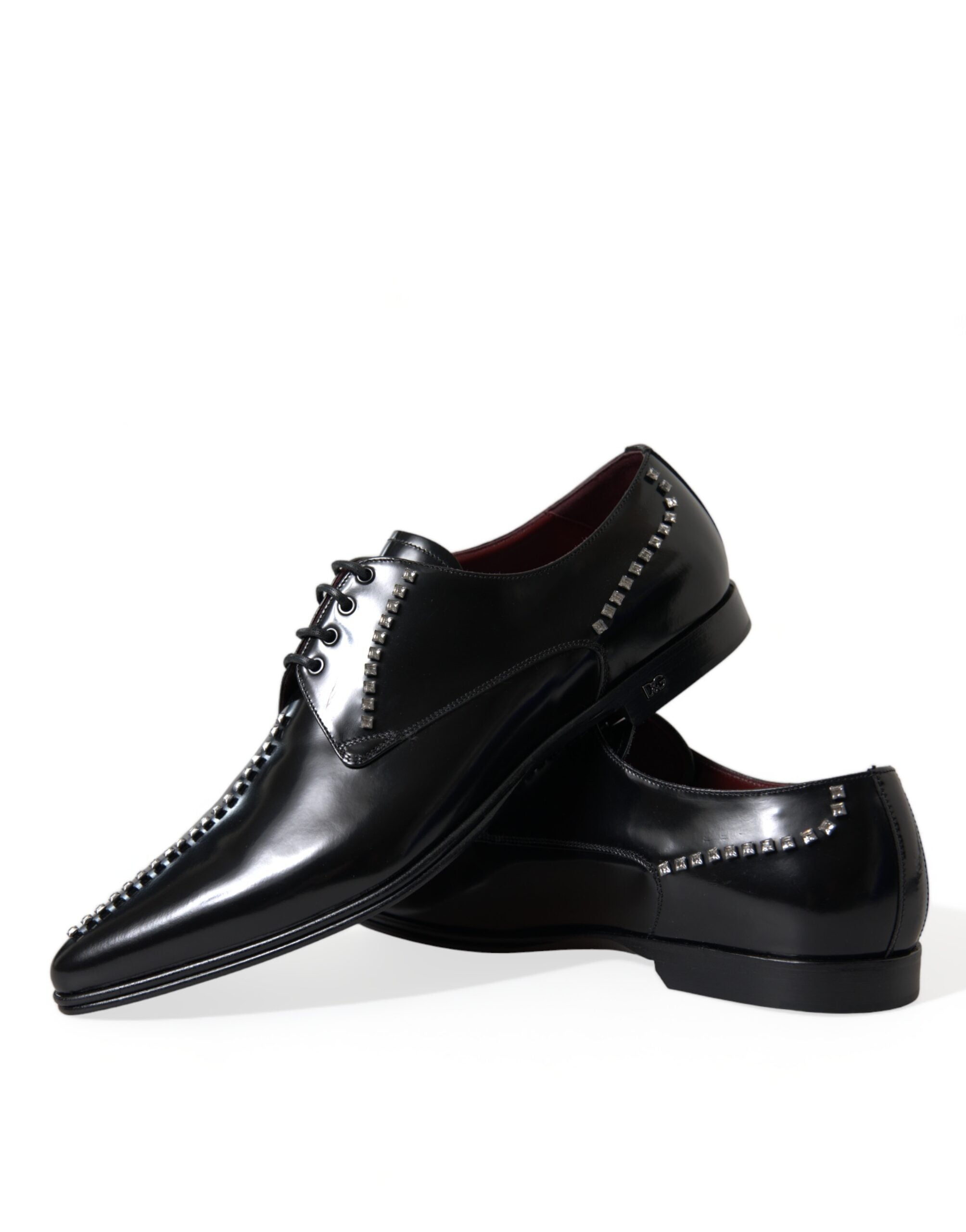 Black leather formal shoes with crystal embellishments from Dolce & Gabbana, designed for elegant dress occasions.