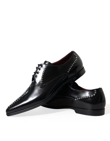 Black leather formal shoes with crystal embellishments from Dolce & Gabbana, designed for elegant dress occasions.