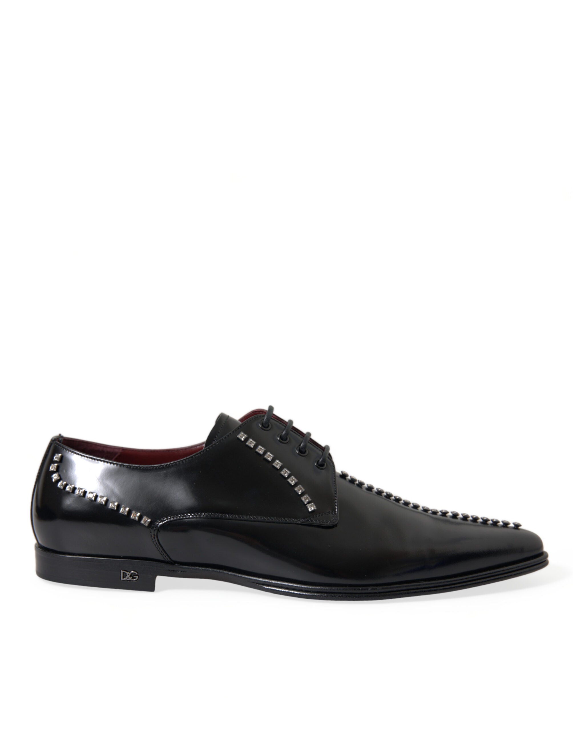 Black leather formal shoes with crystal embellishments by Dolce & Gabbana, designed for elegant dress occasions.