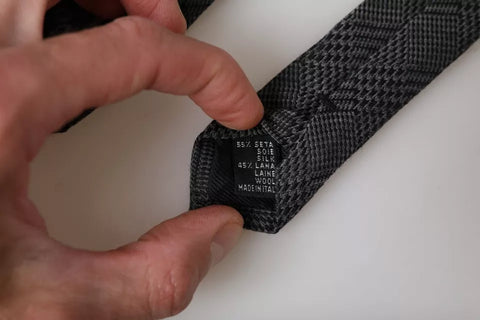 Dark gray silk men's tie with a plaid pattern by Dolce & Gabbana, featuring an adjustable strap and classic design.