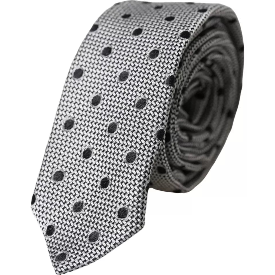 Black and white dot fantasy silk men's tie by Dolce & Gabbana with adjustable length and classic design.