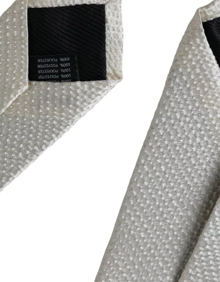 Dolce & Gabbana off-white 100% silk adjustable men's necktie, featuring a sleek and elegant design for formal wear.