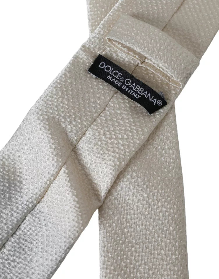 Off White 100% silk adjustable men's necktie by Dolce & Gabbana, featuring a smooth, elegant silk fabric and classic design.