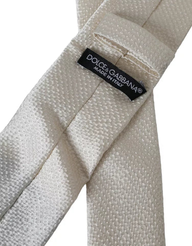 Off White 100% silk adjustable men's necktie by Dolce & Gabbana, featuring a smooth, elegant silk fabric and classic design.