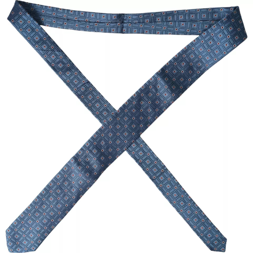 Blue patterned 100% silk adjustable men's tie by Dolce & Gabbana, featuring elegant floral design and classic knot style.
