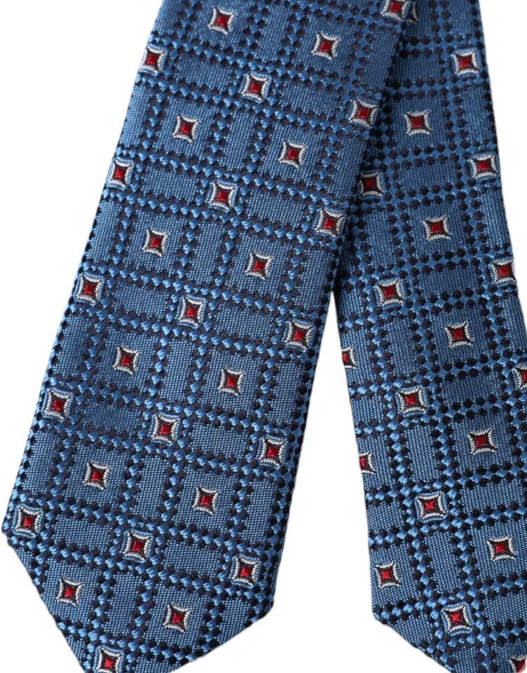 Blue patterned 100% silk men's tie by Dolce & Gabbana, featuring an adjustable design and elegant pattern detail.