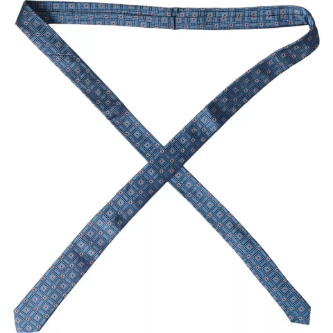 Blue patterned 100% silk men's tie by Dolce & Gabbana, featuring an adjustable design and elegant pattern.