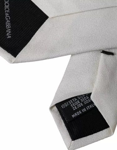 White silk classic adjustable men's tie by Dolce & Gabbana, featuring a smooth, elegant fabric and traditional knot design.