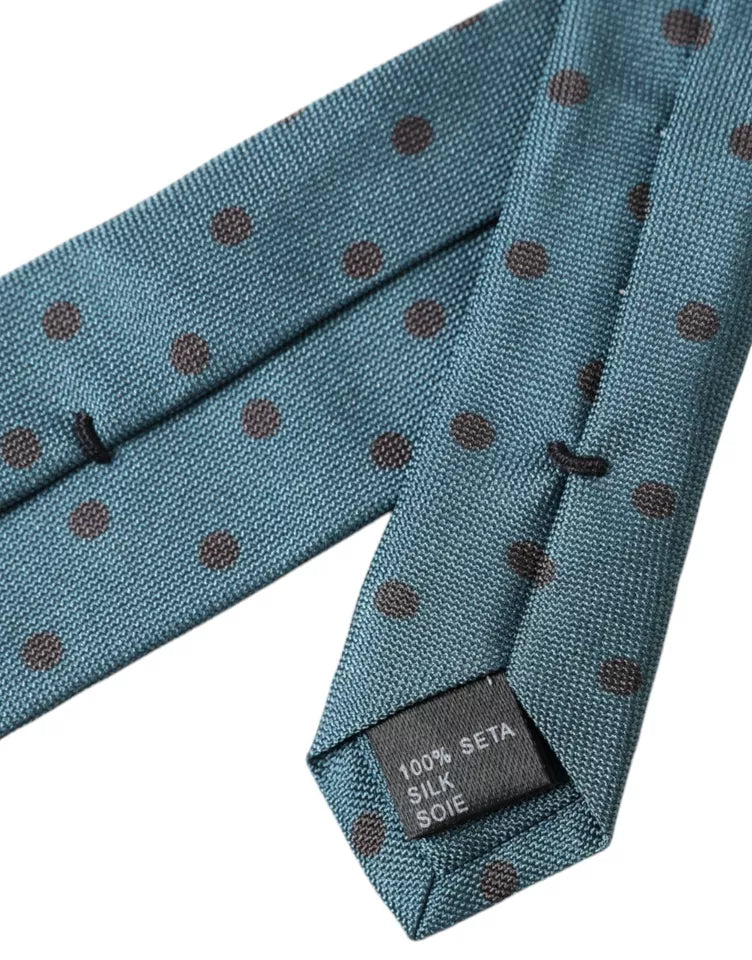 Green and black polka dot silk adjustable men's tie by Dolce & Gabbana displayed on a plain background.