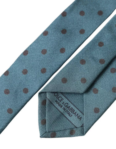 Green and black polka dot silk men's tie by Dolce & Gabbana, adjustable with a classic silk finish and stylish pattern.