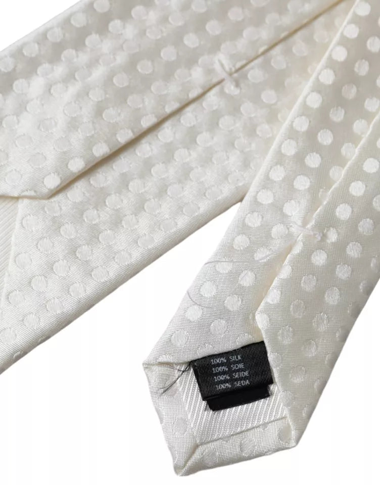 White dotted silk classic men's tie by Dolce & Gabbana, featuring an adjustable design and elegant pattern.