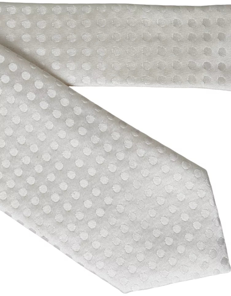 White dotted silk men's tie by Dolce & Gabbana with adjustable length and classic design, featuring a smooth silk texture.
