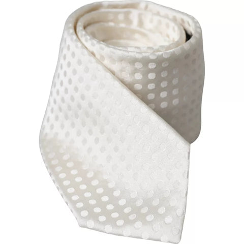 White dotted silk classic men's tie by Dolce & Gabbana featuring an adjustable design and elegant pattern.