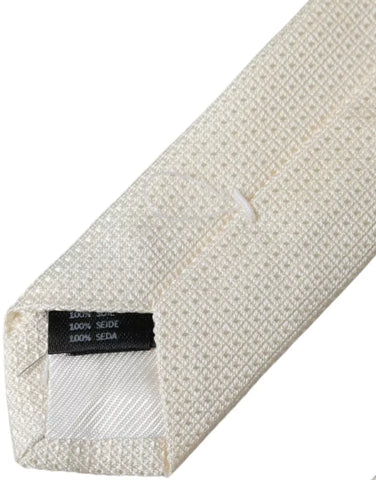 Dolce & Gabbana Off White patterned silk classic adjustable tie displayed on a plain background.