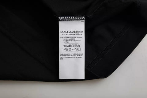 Black cotton round neck short sleeve men's T-shirt by Dolce & Gabbana, showing a simple, classic fit on a model.